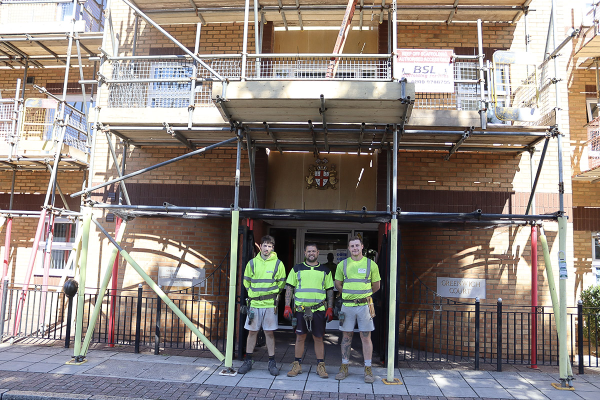 BSL scaffolders in front of the pavement gantry at Greenwich Court, Southsea